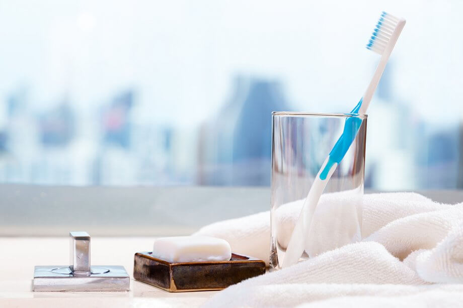 toothbrush sitting in an empty glass