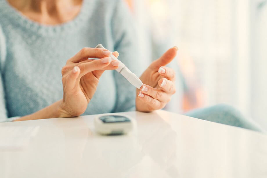 woman checking blood sugar