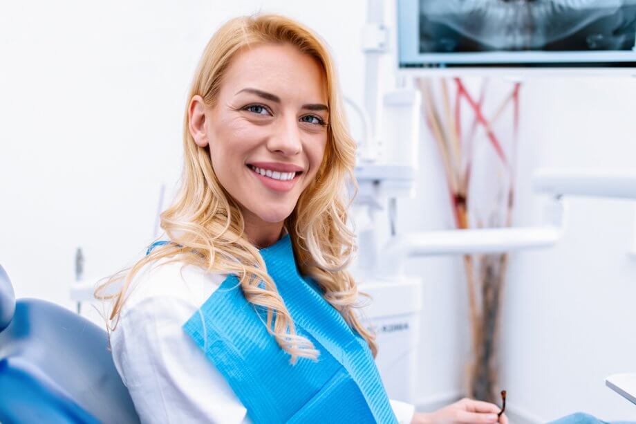 smiling woman sitting in dental chair