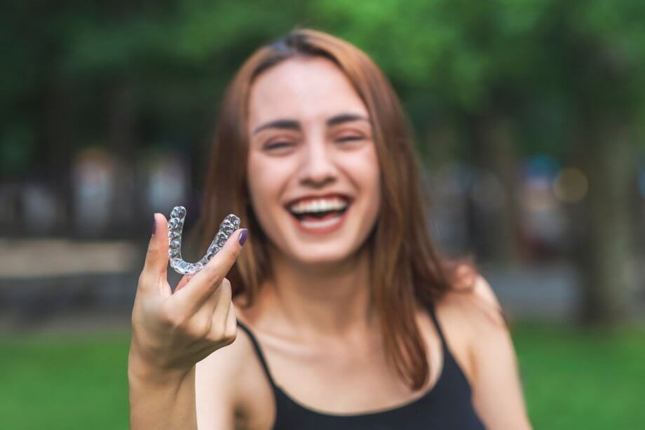 Invisalign Vs. Veneers: Which One Can Improve Your Smile Faster?