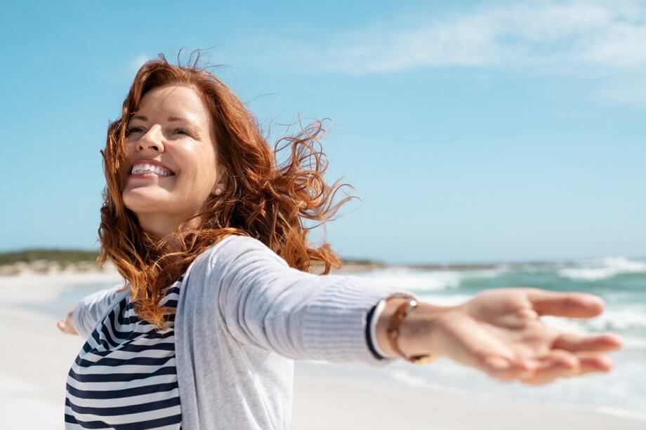 smiling woman at the beach